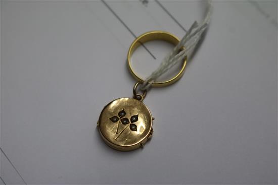 An 18ct gold seed pearl ring and a yellow metal and seed pearl locket.